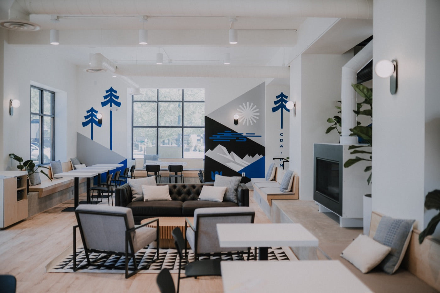 Union café with comfortable seating and a blue mountain mural