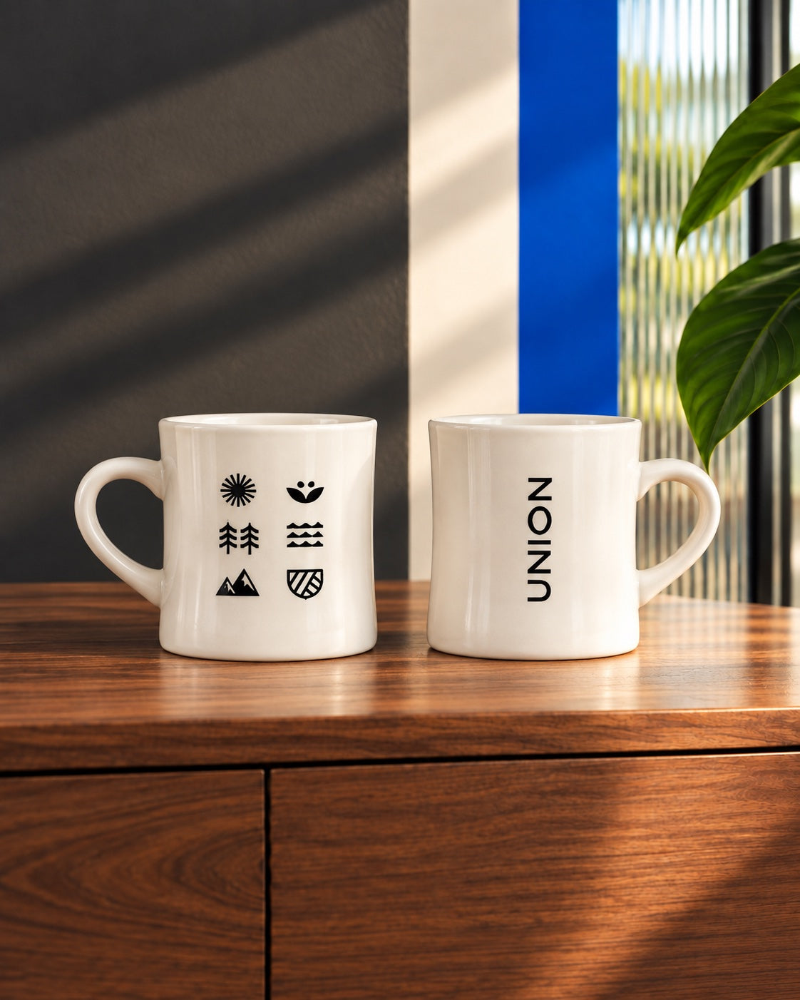Union mugs on a walnut credenza